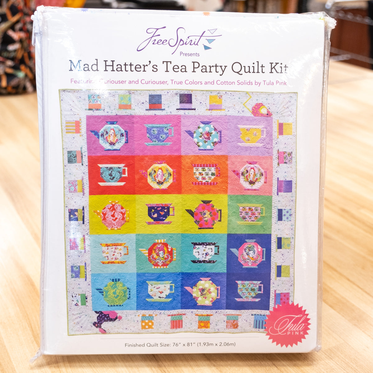 http://quilting-bee-spokane.myshopify.com/cdn/shop/products/MadHatterteapartyQuiltKit-3_1200x1200.jpg?v=1674593674